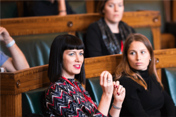 A woman speaking at a conference