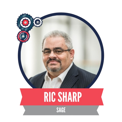 A man with glasses and a beard in a suit poses for a portrait inside a circular frame, adorned with gear-like icons and a red ribbon displaying the name "Ric Sharp" and the title "Sage."