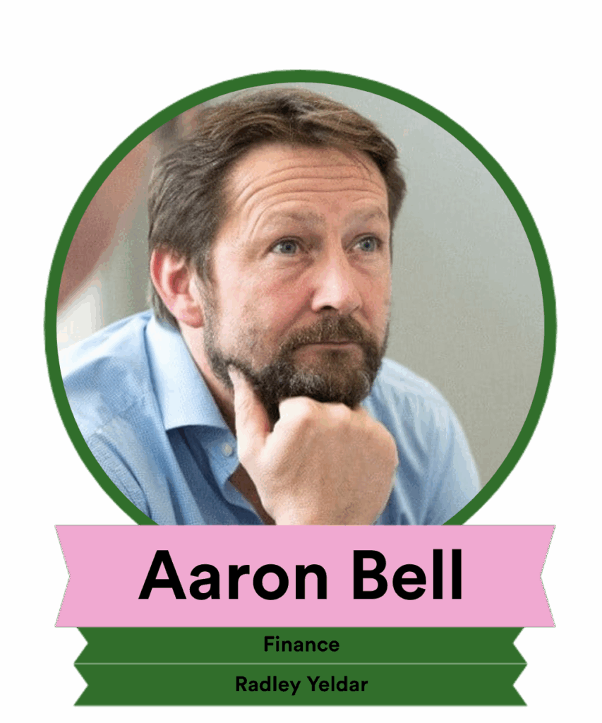 A portrait of a thoughtful man with light brown hair and a beard, wearing a blue shirt. He is resting his chin on his hand, indicating contemplation. Below the image, his name "Aaron Bell," title "Finance," and company "Radley Yeldar" are displayed.