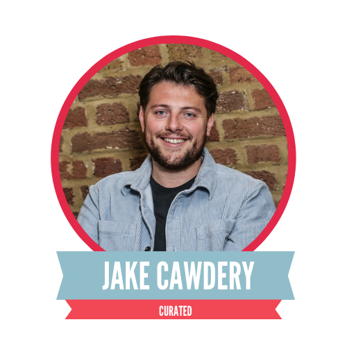A man smiling in front of a brick wall, framed by a red circle. Below, a banner with the name "Jake Cawdery" and the word "Curated."