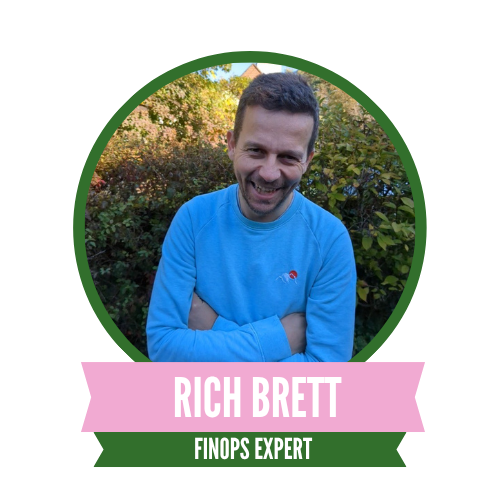 Man smiling with arms crossed, wearing a blue sweater, standing outdoors. Surrounded by greenery, framed in a circular badge with text: "Rich Brett, FinOps Expert."